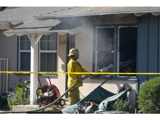 Firemen try to save Orange County home